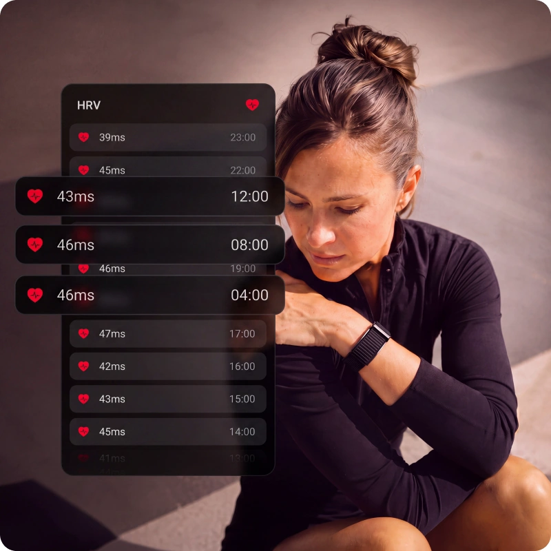 A woman resting after training, beside a log of her HRV readings through the day