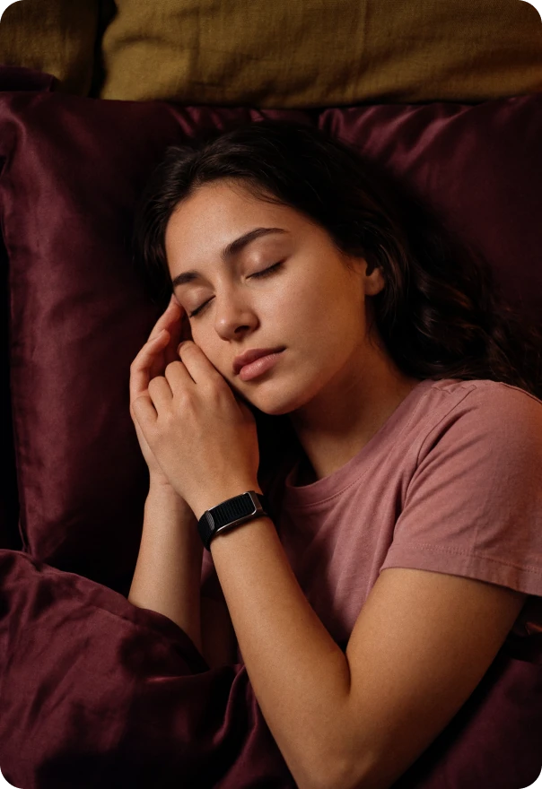 Emily asleep, wearing the HLTH Band