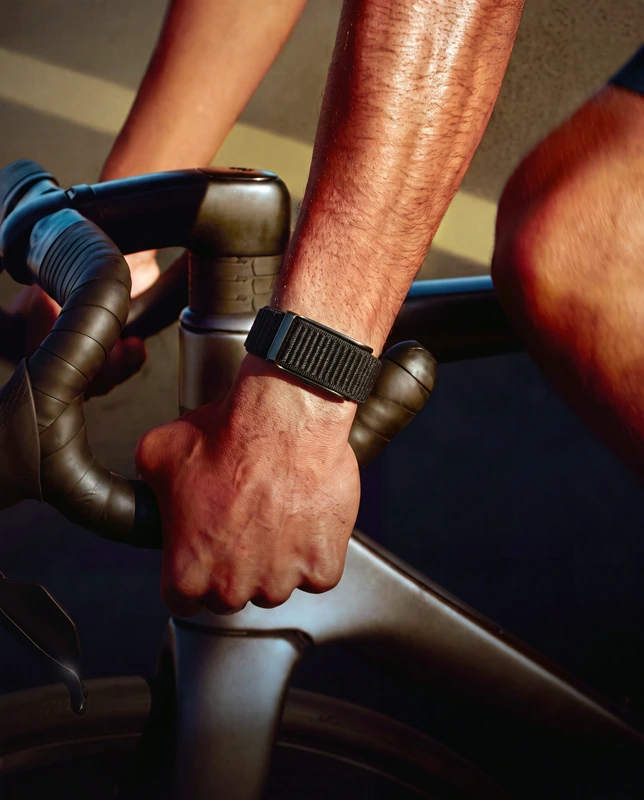 Someone sitting and thinking something through, wearing the HLTH Band
