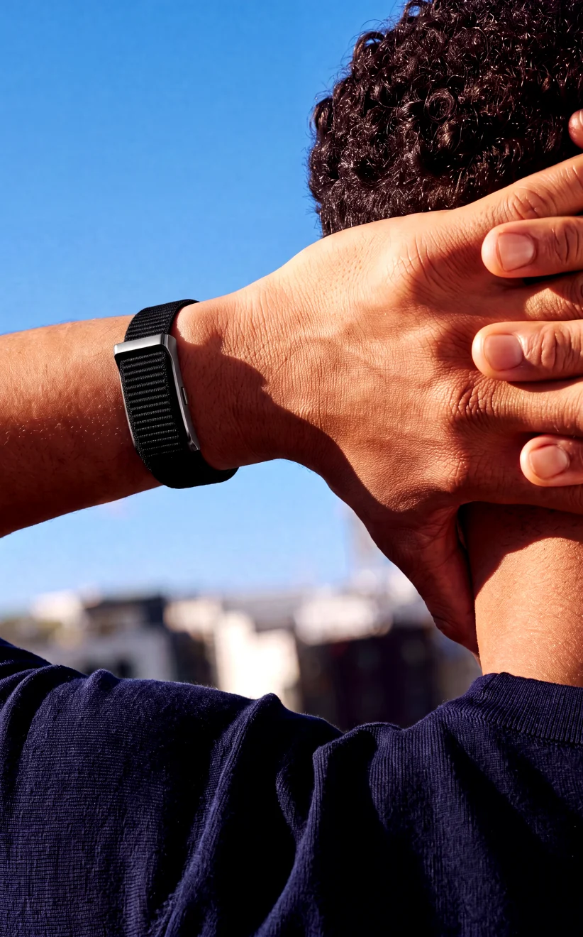 James resting after exercise, wearing the HLTH Band